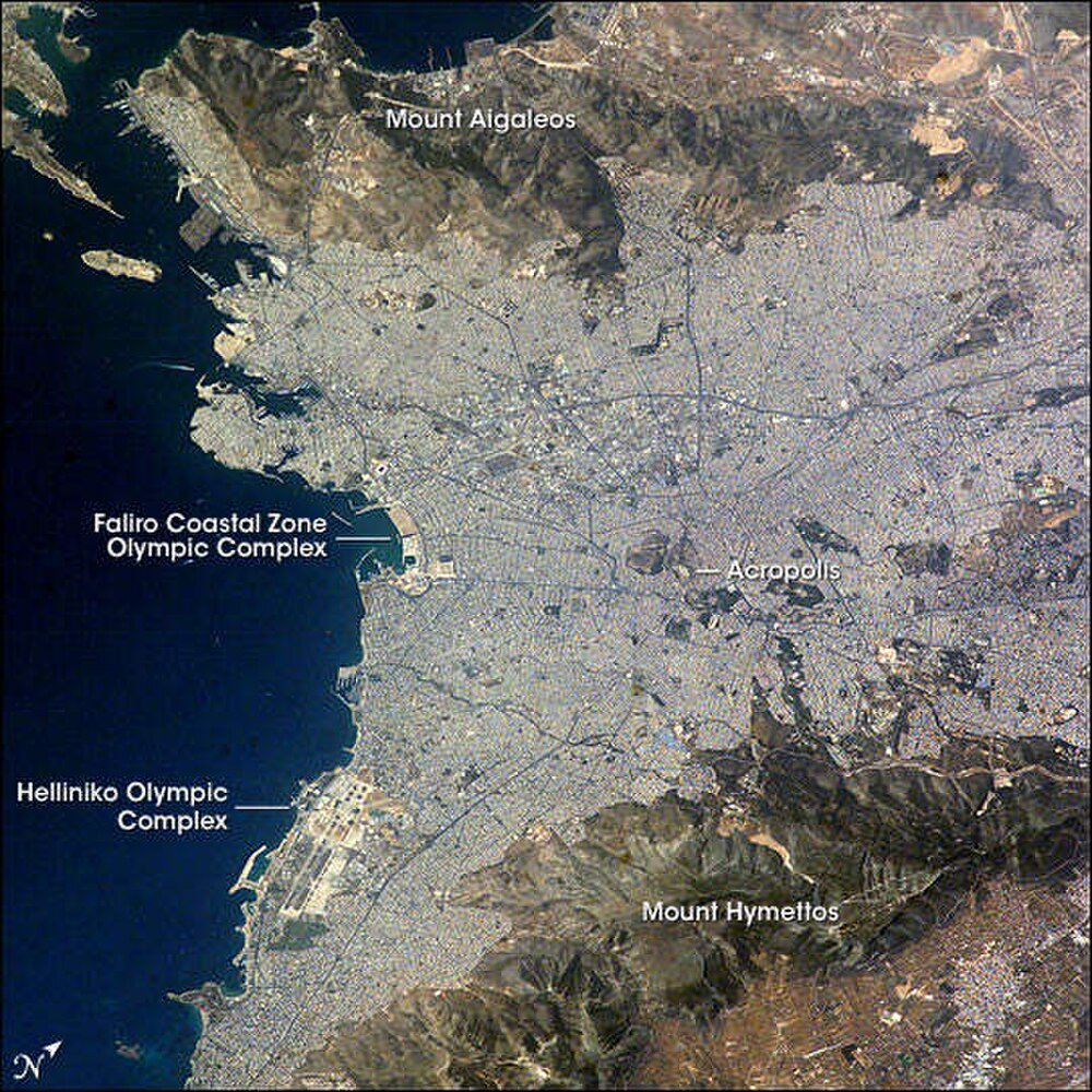 Aerial View of Athens with Olympic Complexes and Mountains Aerial view of Athens city showing Mount Aigaleos, Mount Hymettos, Acropolis, Faliro Coastal Zone Olympic Complex, and Helliniko Olympic Complex