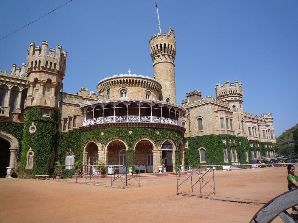 Bangalore Palace with Ivy and Towers Historic Bangalore Palace with ivy-covered walls and medieval-style towers under clear blue sky