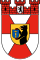 Heraldic coat of arms with black eagle and red-white shield Coat of arms featuring a black eagle with a yellow beak and red tongue on a red and white shield, symbolizing heritage and nobility.