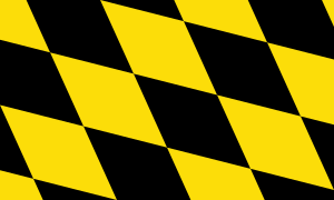 Abstract pattern of alternating black and yellow diamond shapes creating a dynamic geometric design background