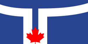 Flag featuring a blue background with a white T shape and a red maple leaf symbolizing Canadian identity and unity