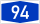 Blue rectangular road sign with white number 94 indicating highway or route number 94 for navigation and travel.