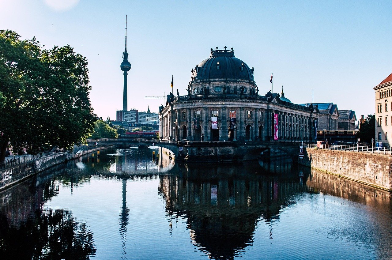 Historic Bode Museum on the Spree River with Berlin TV Tower in the background on a clear sunny day