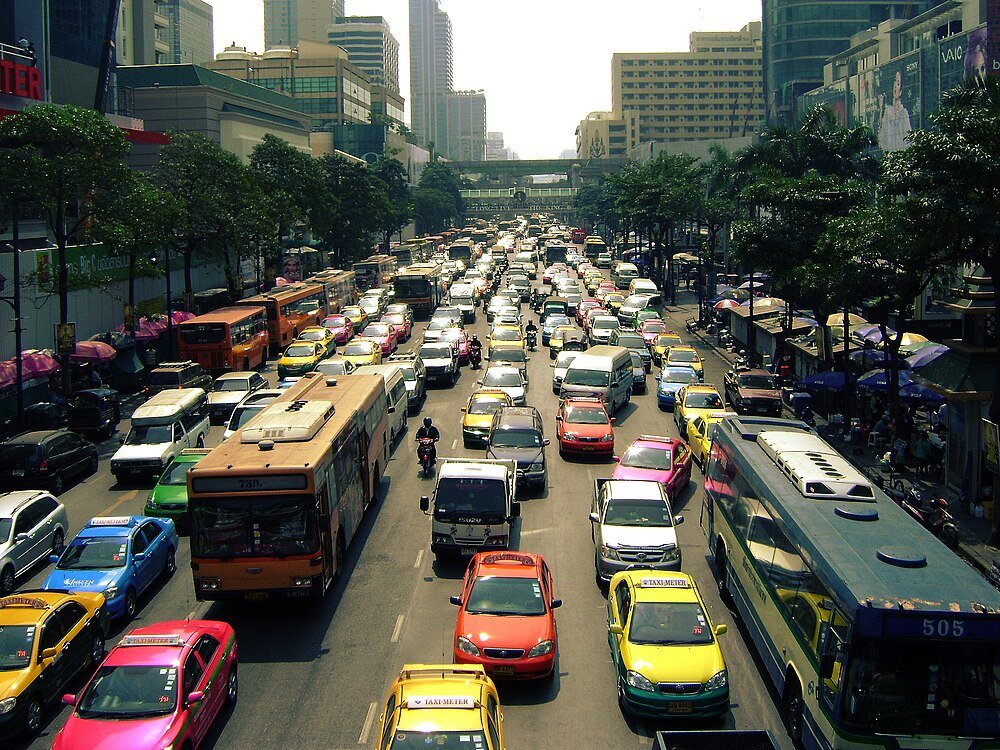 Busy urban street with heavy traffic congestion Heavy traffic congestion with buses, taxis, and cars on a busy city street during daytime in an urban area