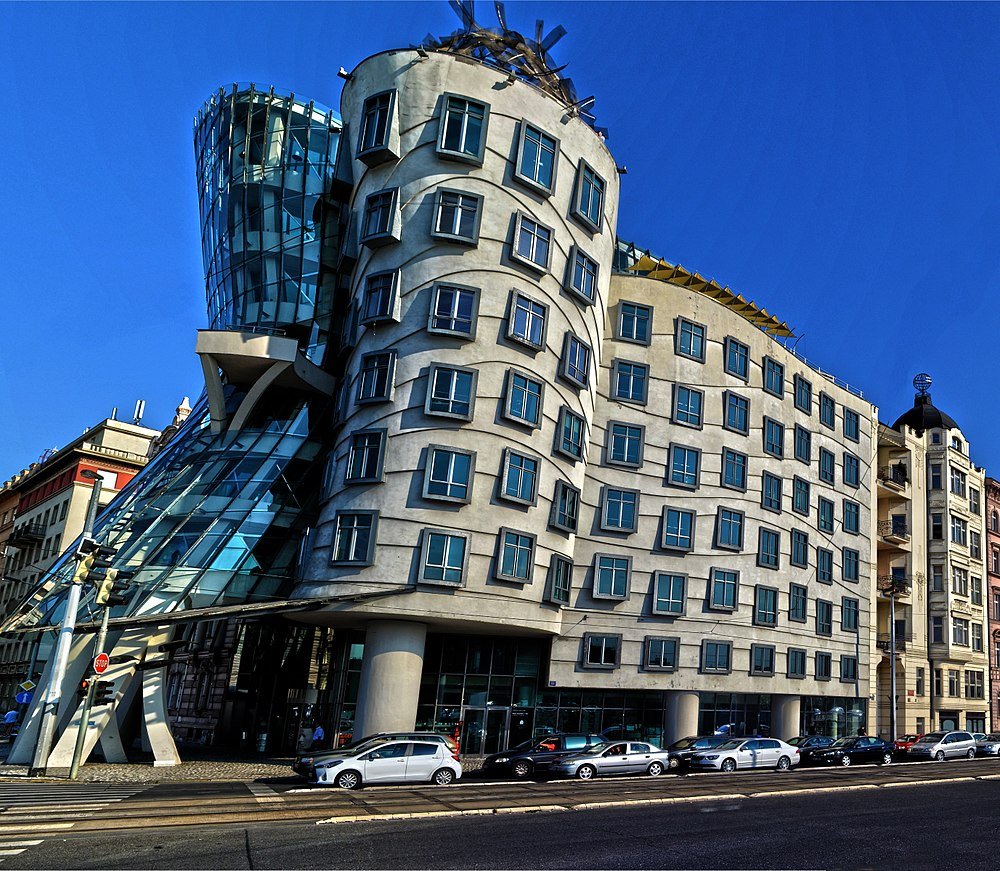 The Dancing House in Prague, a famous modern architectural landmark with unique curved design and glass structure.