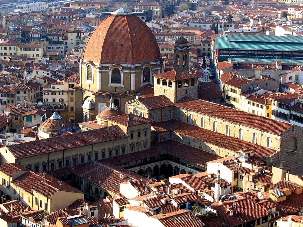 Florence cityscape with San Lorenzo Basilica dome Aerial view of historic Florence cityscape with terracotta rooftops and the prominent dome of San Lorenzo Basilica