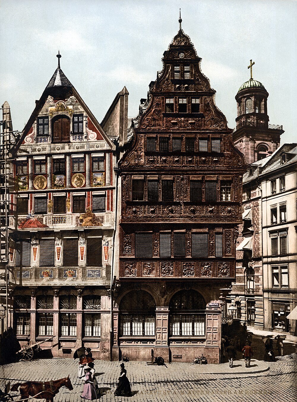 Historic half-timbered houses in Frankfurt am Main Historic half-timbered houses with intricate wood carvings in Frankfurt am Main, Germany, featuring cobblestone street and pedestrians