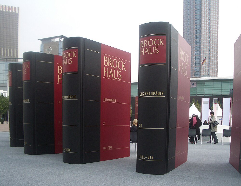 Giant Brockhaus encyclopedia book sculptures outdoors Giant Brockhaus encyclopedia book sculptures displayed outdoors in an urban setting with people nearby