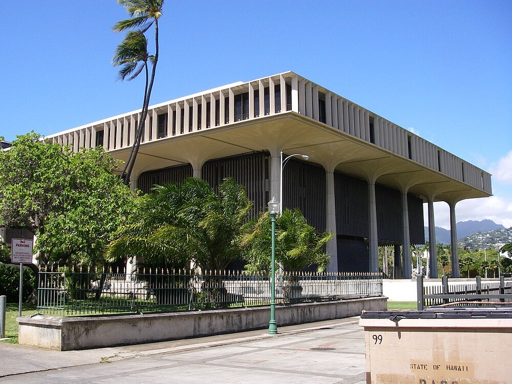 Hawaii State Capitol Building in Honolulu Hawaii State Capitol building with modern architecture and palm trees under a clear blue sky in Honolulu