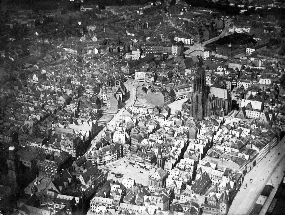 Historic European city aerial view with cathedral Aerial black and white photo of a historic European city center with dense old buildings and a large cathedral