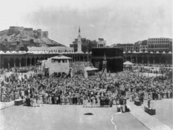 Historic Kaaba Pilgrimage in Mecca Historic black and white photo of Kaaba surrounded by large crowd of Muslim pilgrims during Hajj in Mecca