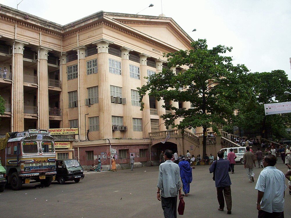 Historic Medical College Building Exterior Historic medical college building with classical columns and people walking outside in an urban setting