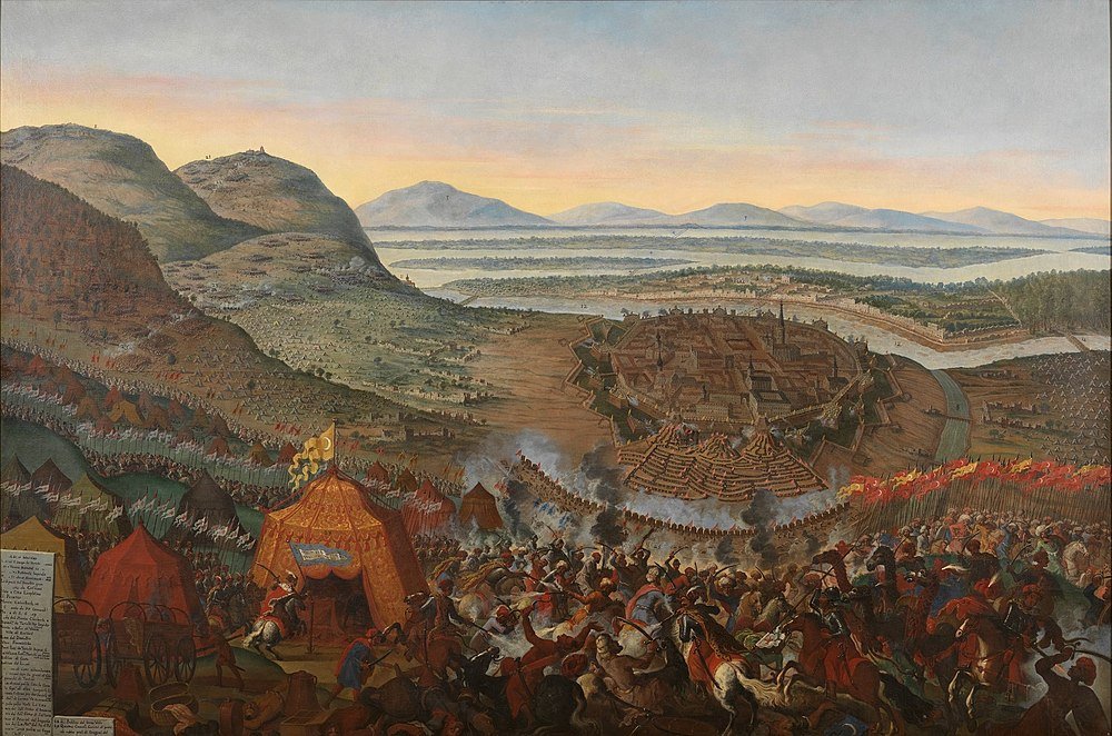 Historical battle near fortified city at sunset Historical battle scene with cavalry and infantry attacking a fortified city surrounded by mountains and rivers at sunset.