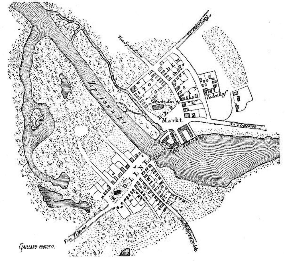 Historical German town map with river and streets Historical black and white map of a town with river, streets, buildings, and landmarks labeled in German.