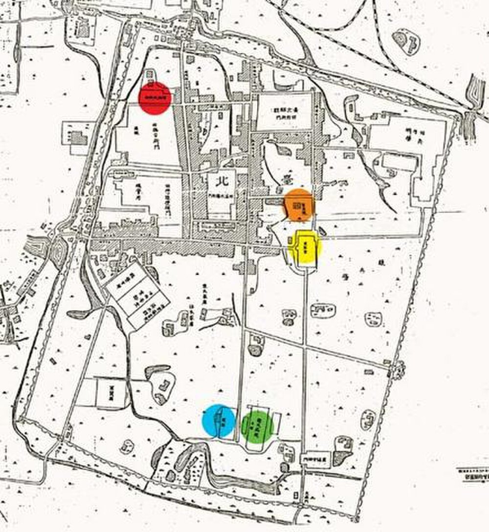 Historical Japanese map with colored markers Historical map with colored markers highlighting specific areas and buildings in a detailed layout with Japanese text.