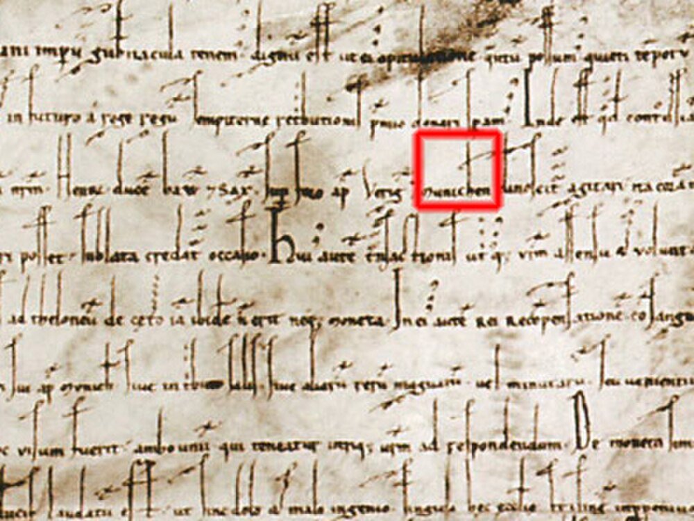 Medieval Latin Manuscript with Highlighted Text Ancient medieval manuscript with Latin script and highlighted section showing historical handwritten text on parchment.