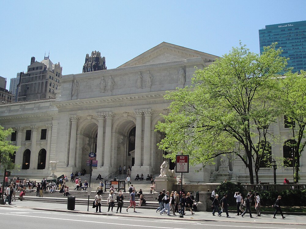 New York Public Library exterior with visitors New York Public Library building with classical architecture, people walking and sitting on steps, and green trees