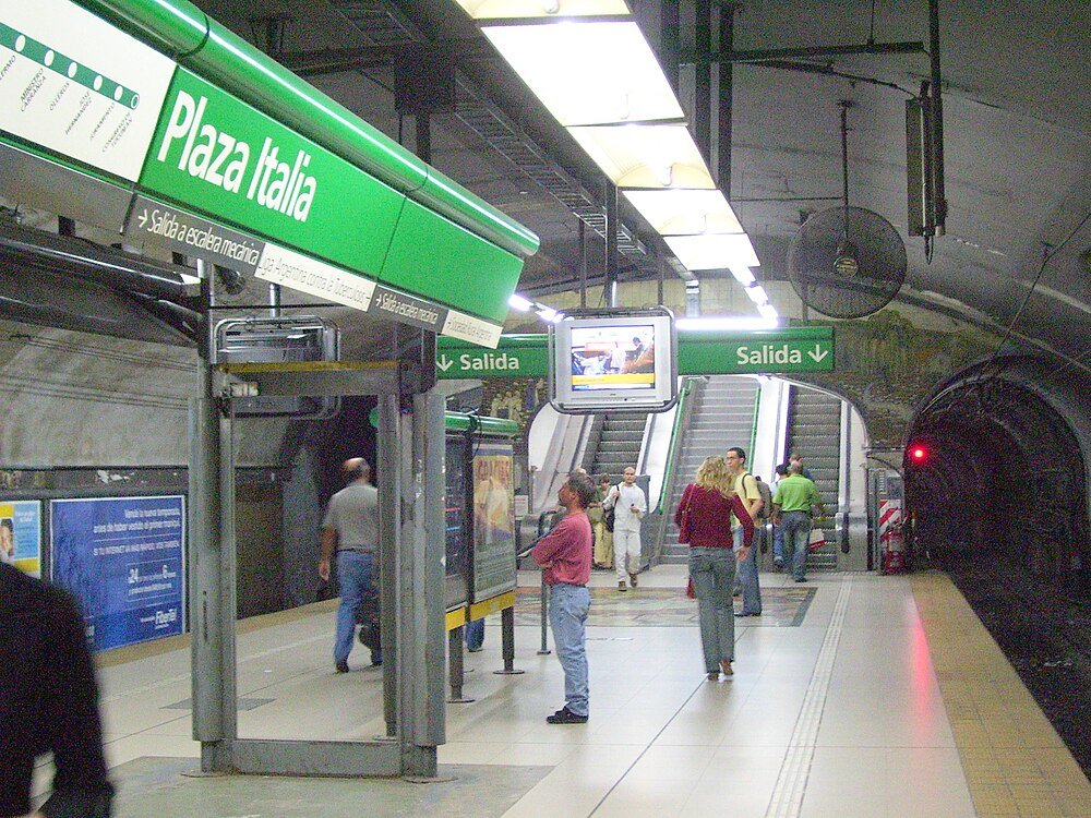 Plaza Italia Buenos Aires Subway Station Platform Plaza Italia subway station platform with passengers waiting and escalators in Buenos Aires metro