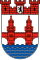 Red Castle Emblem with Blue Waves Shield Red castle emblem with two towers above blue waves on white shield, symbolizing a historic coastal city or fortress.