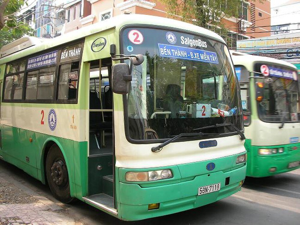 Saigon Bus Number 2 at Ben Thanh Station Green and white Saigon public bus number 2 at Ben Thanh station in Ho Chi Minh City, Vietnam with open door and urban background