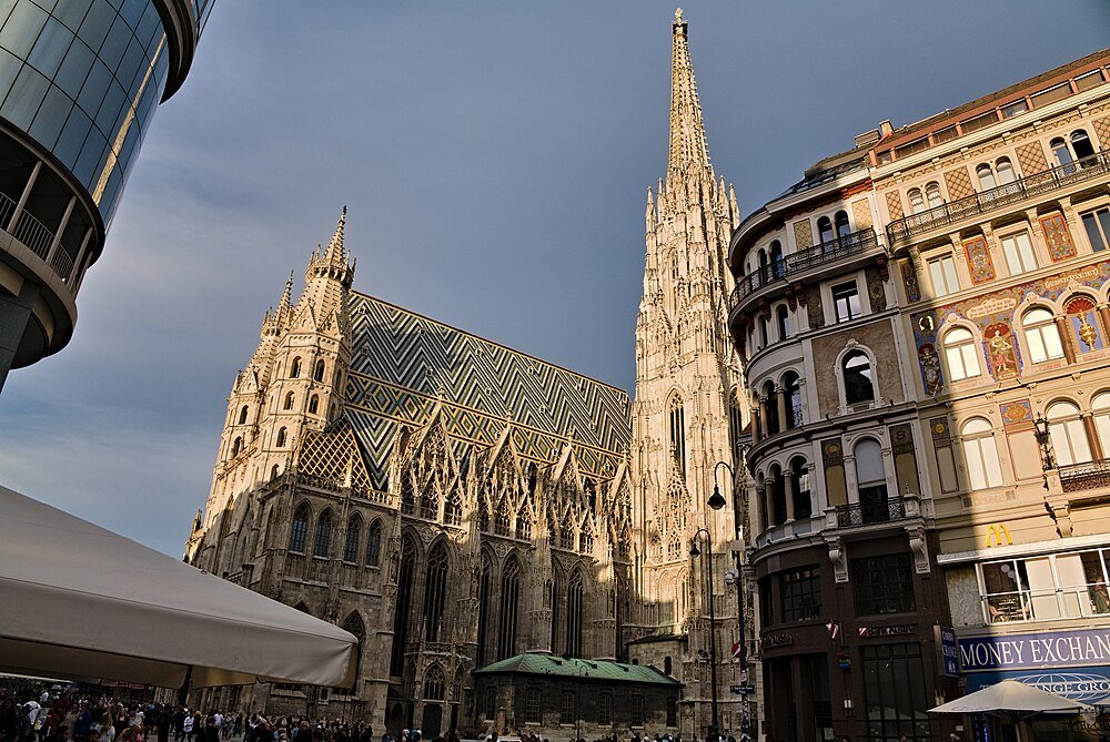St. Stephen's Cathedral in Vienna with its Gothic architecture and colorful tiled roof under a clear sky