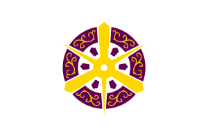 Traditional Asian wheel emblem with intricate golden patterns and purple background symbolizing cultural heritage