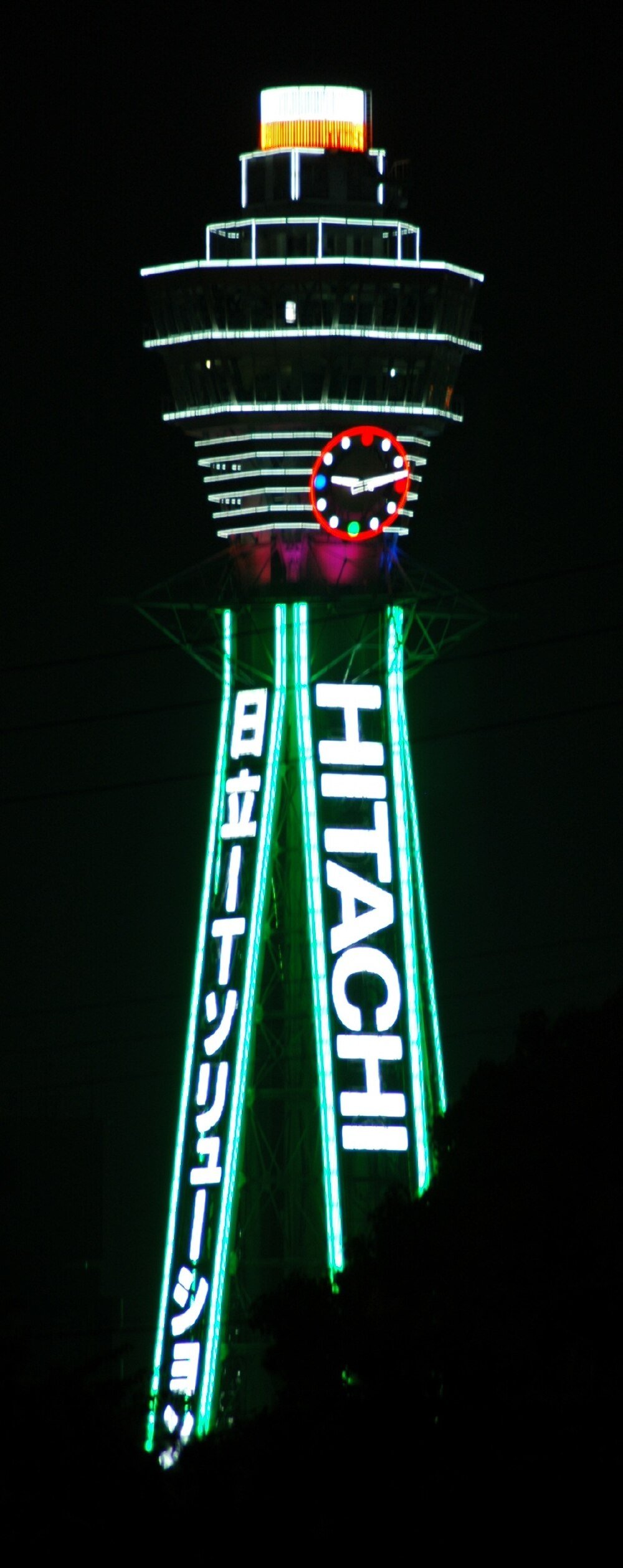 Tsutenkaku Tower Osaka Hitachi Neon Lights Night view of Tsutenkaku Tower in Osaka, Japan illuminated with Hitachi neon lights and a colorful clock.
