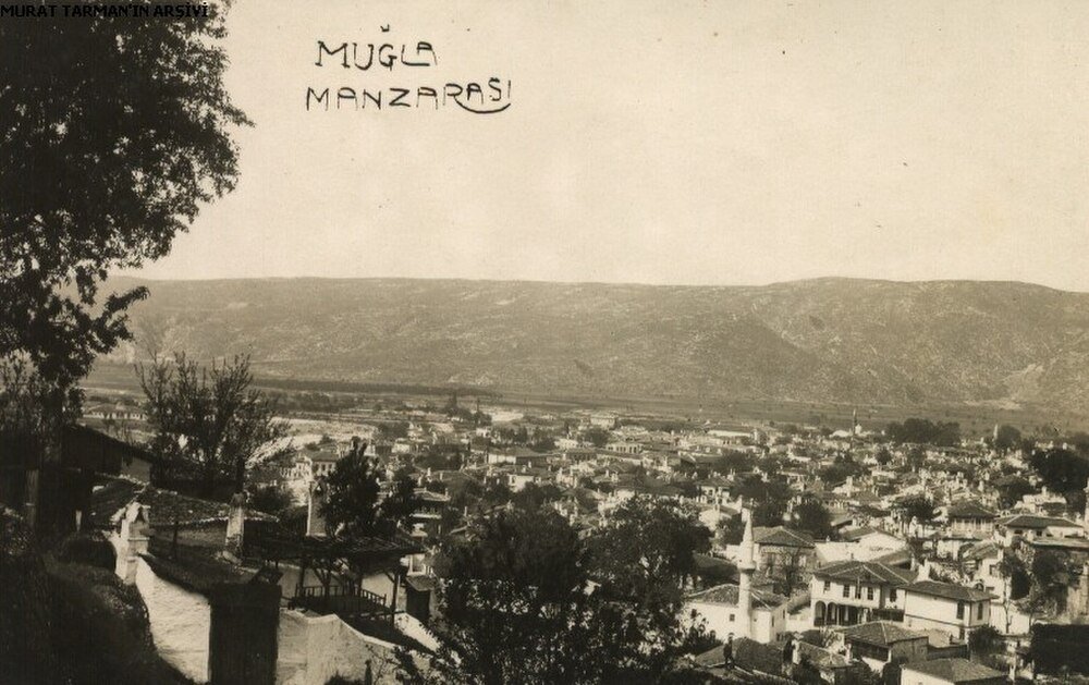 Vintage panoramic view of Muğla cityscape with traditional houses and surrounding hills in Turkey