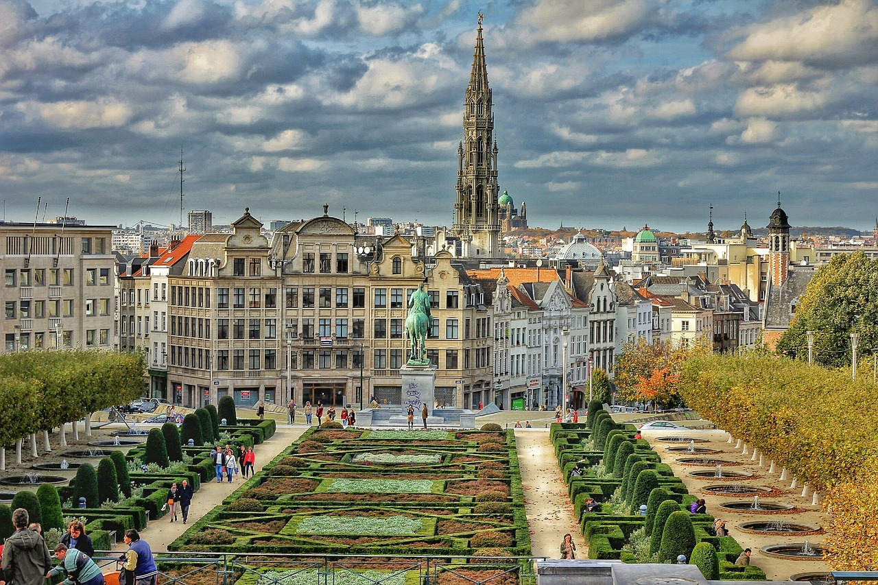 Brussels cityscape with Mont des Arts and Town Hall spire Scenic view of Brussels city with Mont des Arts garden, historic buildings, and the tall spire of Brussels Town Hall