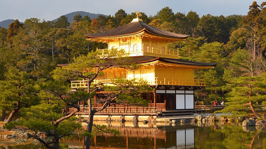 Golden Pavilion Kinkaku-ji Temple Kyoto Japan Golden Pavilion Kinkaku-ji temple in Kyoto Japan surrounded by trees and reflected in a calm pond