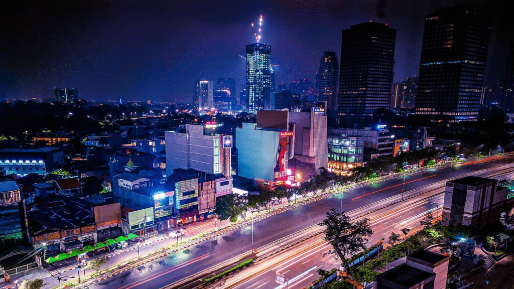 Night cityscape of Jakarta with illuminated skyscrapers and the elevated highway — the megacity capital of Indonesia and one of Southeast Asia's largest urban agglomerations