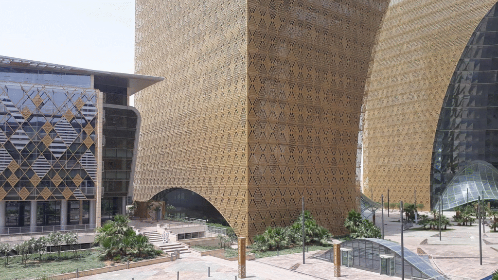 Modern office buildings with unique golden-lattice exteriors in central Riyadh — including the King Abdullah Financial District towers, the new financial-and-business core of Saudi Arabia's capital