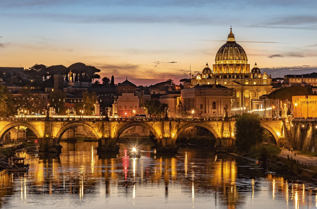 Stunning sunset view of St. Peter's Basilica and Ponte Sant'Angelo bridge over the Tiber River in Rome, Italy