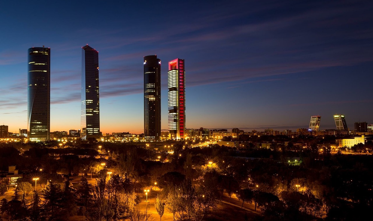 Madrid Cuatro Torres Business District at Night Night skyline of Madrid with illuminated Cuatro Torres business district and modern skyscrapers at dusk