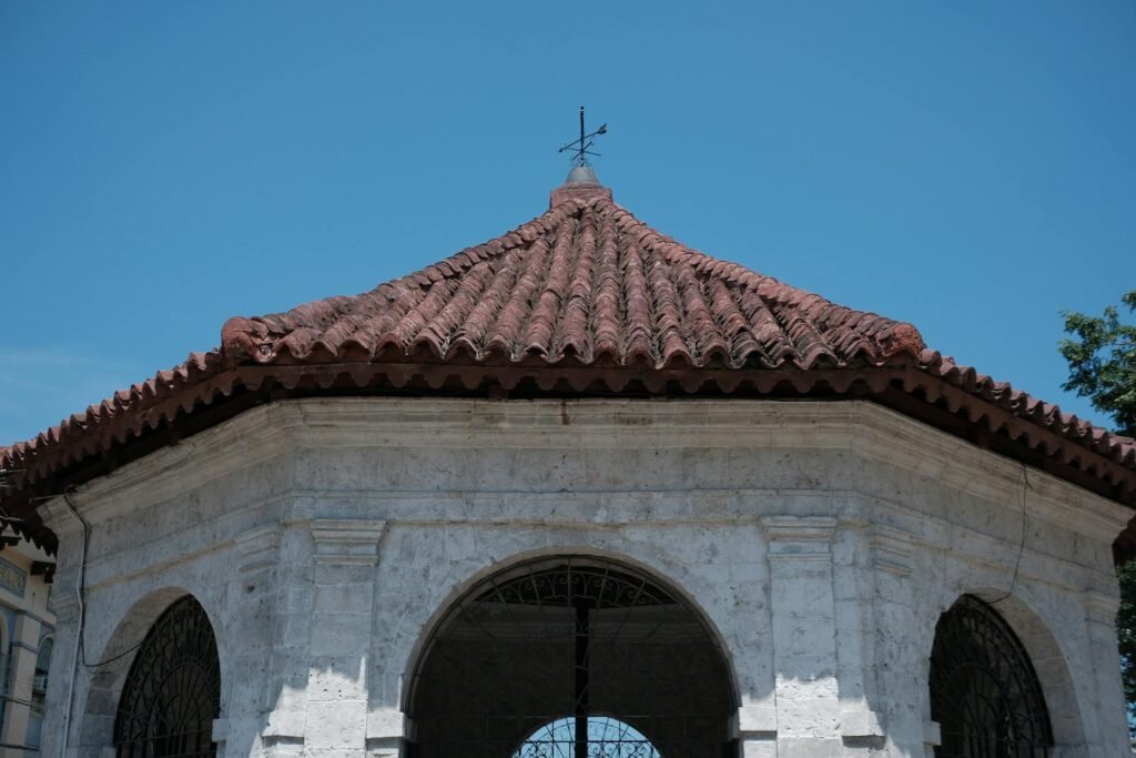 Magellan's Cross Pavilion in downtown Cebu City — the wooden cross planted in 1521 marking the symbolic birth of Christianity in the Philippines, encased in a small open-sided chapel
