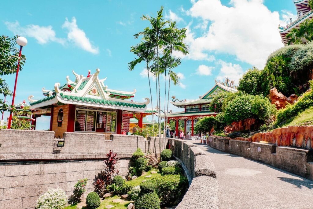 Cebu Taoist Temple in the Beverly Hills district — multi-tiered traditional Chinese architecture surrounded by lush tropical gardens, reflecting the city's diverse cultural heritage