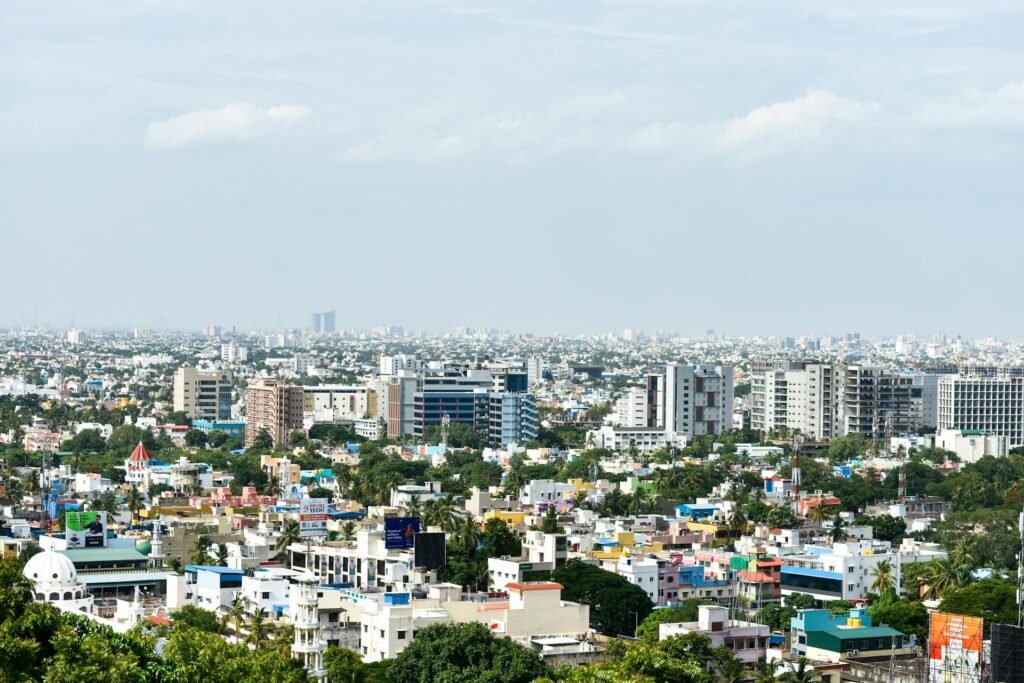 Aerial view of colorful high-rise buildings in Chennai under a clear sky showing the city's modern districts