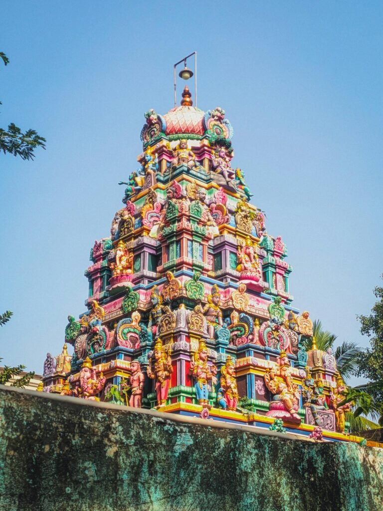 Colorful gopuram of a Chennai Hindu temple showcasing traditional Dravidian architecture with intricate sculpted figures