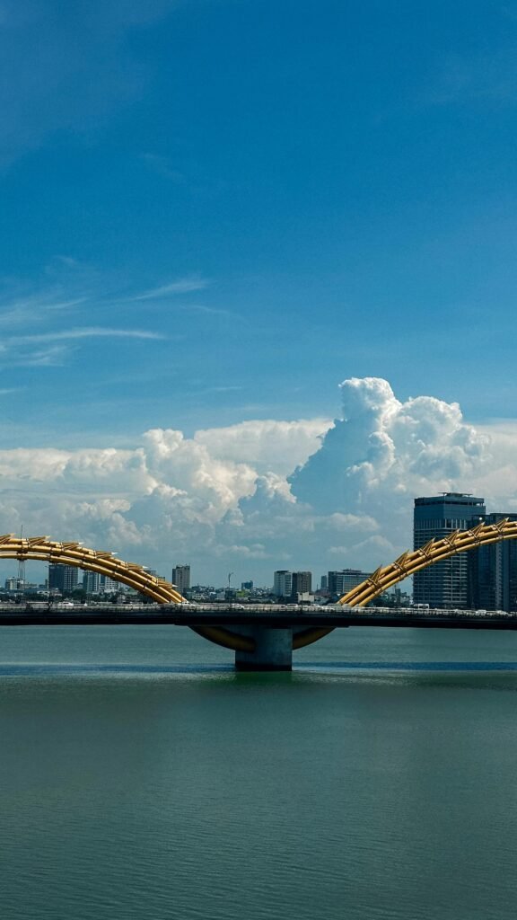 The iconic Dragon Bridge of Da Nang crossing the Han River — the 666-meter sculptural bridge with its dragon's-head architecture that performs fire-breathing shows on weekend nights