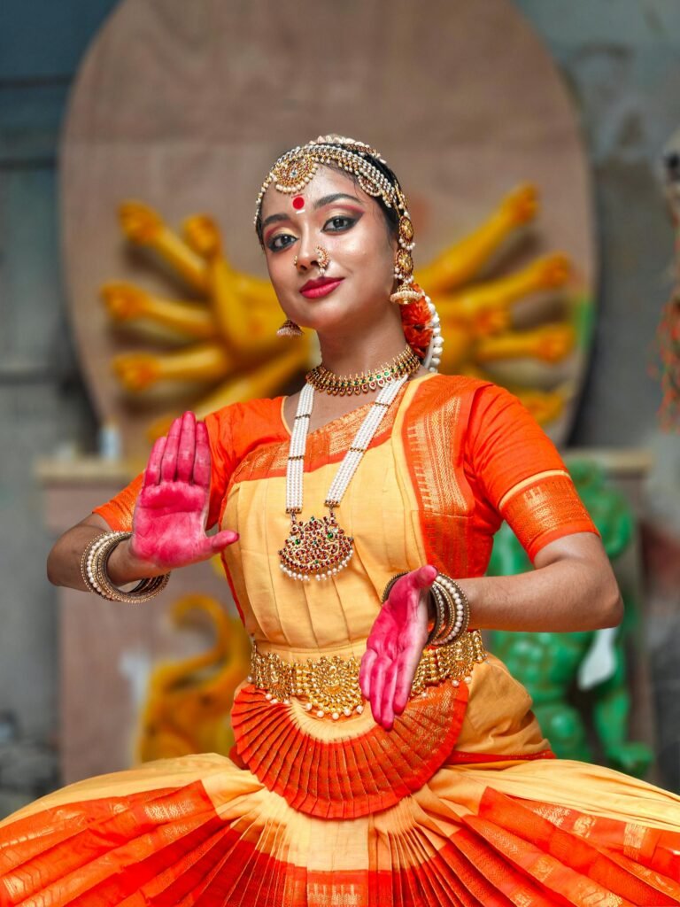 Bharatanatyam dancer in traditional attire striking a graceful classical pose