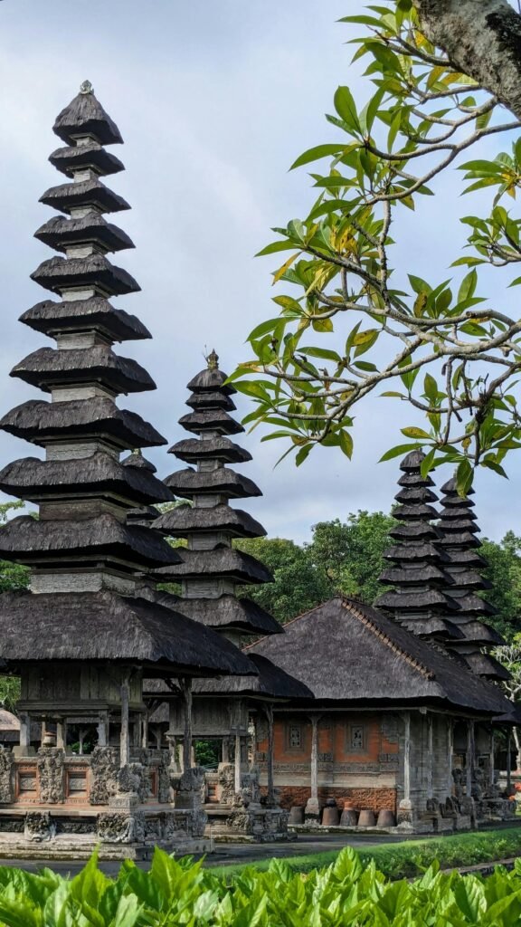 Traditional architecture of Taman Ayun Temple in Bali surrounded by lush greenery — classic Balinese pura design