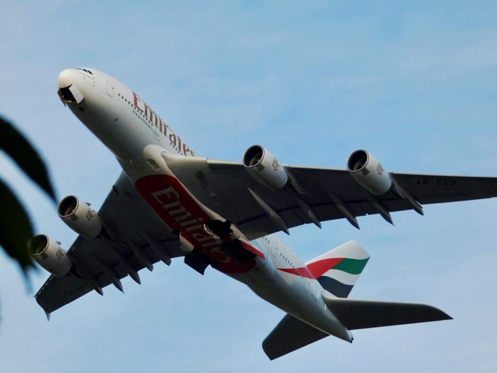 An Emirates Airbus A380 in flight, the home airline of Dubai International Airport