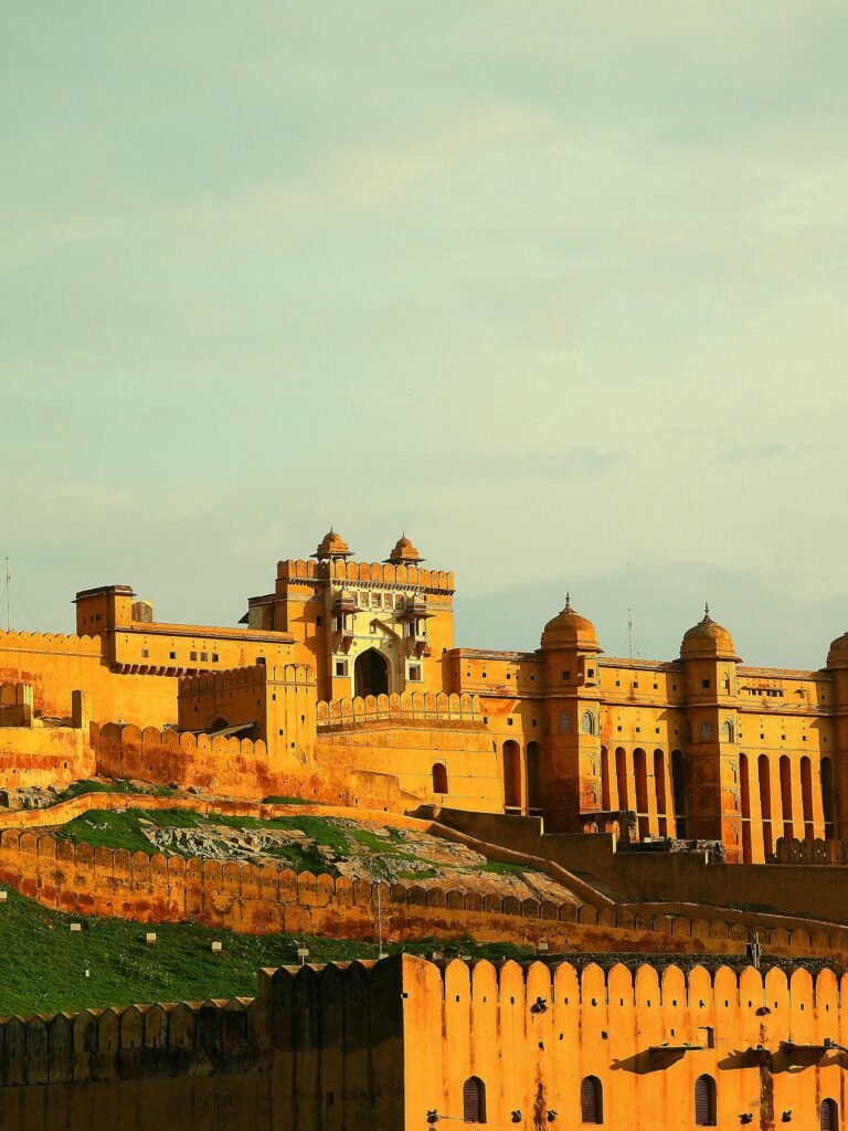Amber Fort outside Jaipur captured in golden hues at sunset, set in the Aravalli Hills