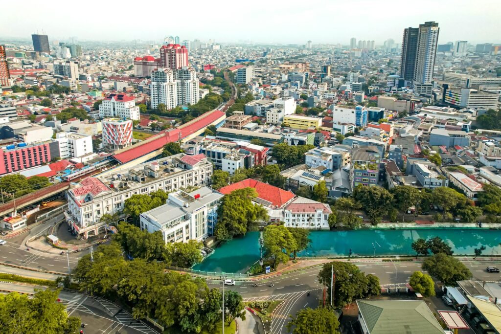 Aerial view of Jakarta's historic Pasar Baru market — one of the city's oldest commercial districts, dating to 1820, where Chinese-Indonesian and Indian-Indonesian trader communities have anchored the central retail economy for over 200 years
