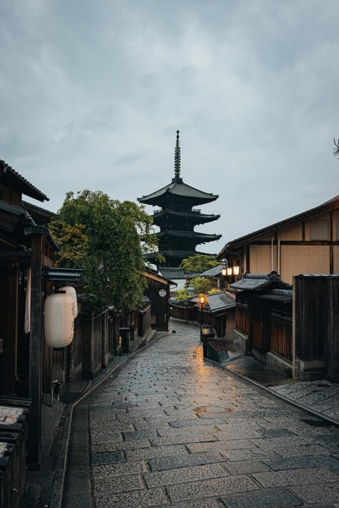 The Yasaka Pagoda (Hōkan-ji Temple) in Kyoto at dusk — the 5-story wooden pagoda dating from 592 CE that anchors the iconic Sannenzaka-Ninenzaka preserved streets in the Higashiyama district