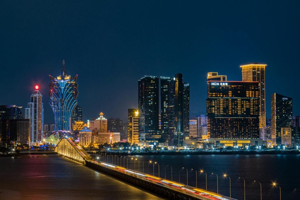 The Macau skyline at night with illuminated casino hotels and the unmistakable Cotai Strip silhouette