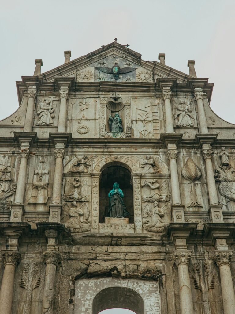 Close-up of the Ruins of St. Paul's facade in Macao, showcasing the intricate stone carvings and 17th-century baroque architecture