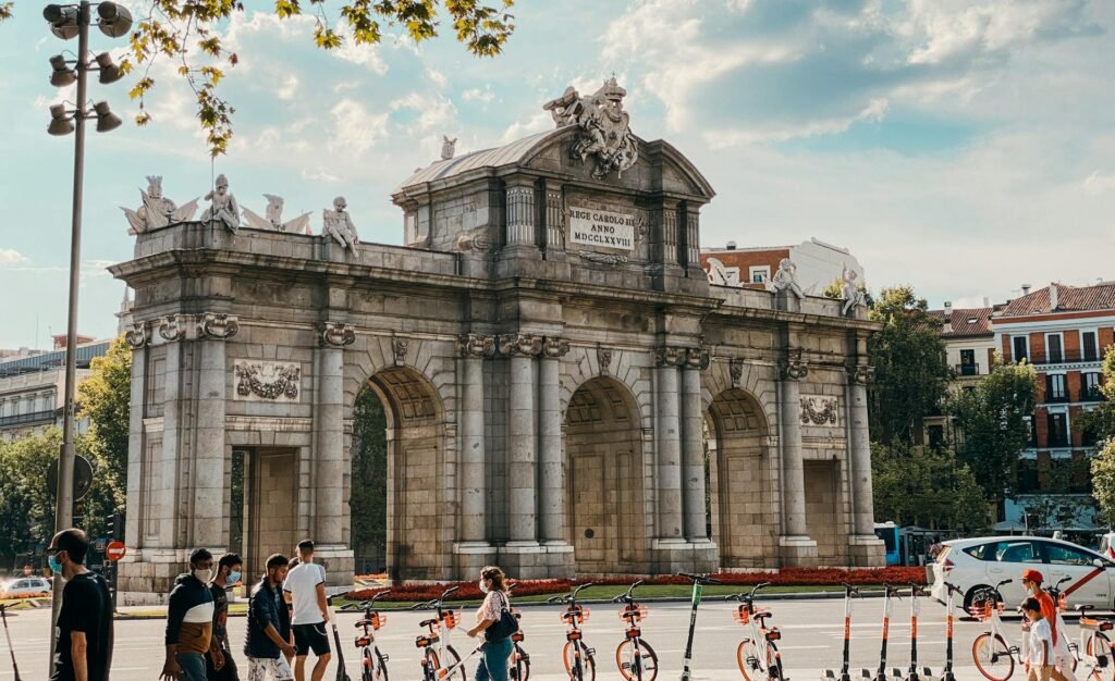The Puerta de Alcalá in central Madrid — the 1778 Neoclassical monumental gateway commissioned by King Carlos III, the symbolic ceremonial entrance to the historic city