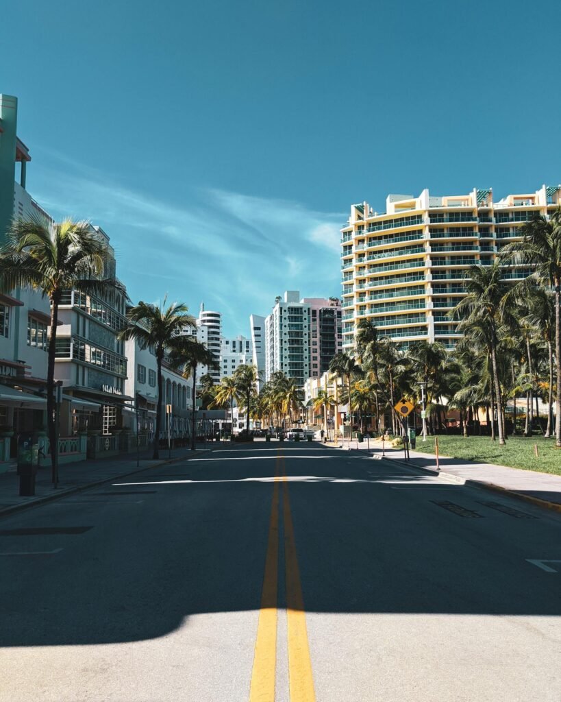Empty streets with palm trees and Art Deco modern architecture in Miami Beach, Florida