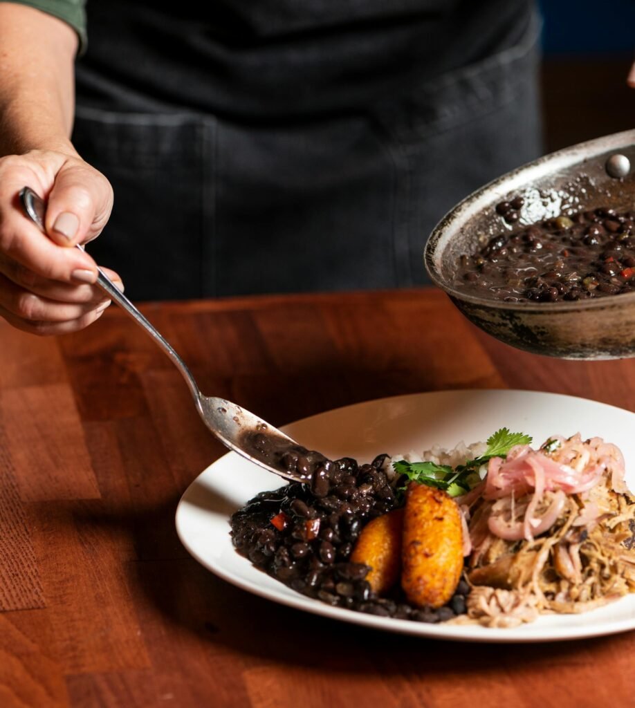 Delicious traditional Cuban dish with rice, black beans, and plantains — classic Little Havana cuisine